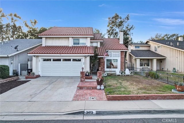 view of front of home featuring a front yard and a garage