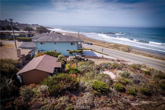 drone / aerial view with a beach view and a water view