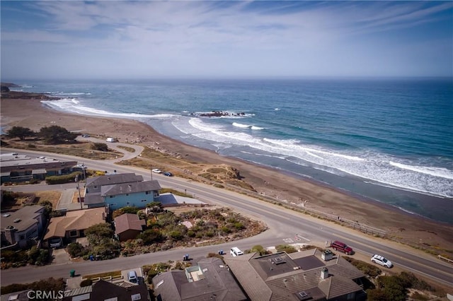 bird's eye view with a view of the beach and a water view