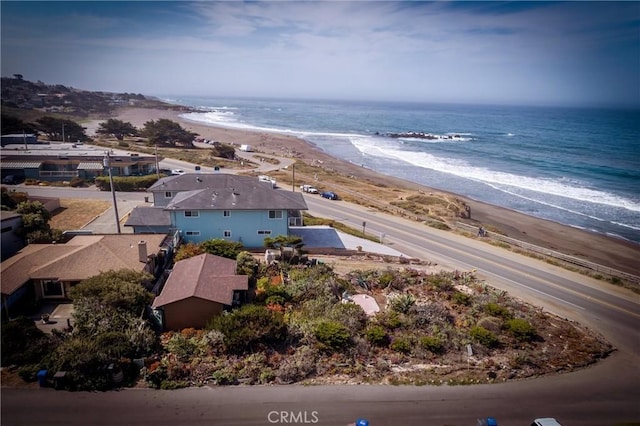 bird's eye view featuring a beach view and a water view