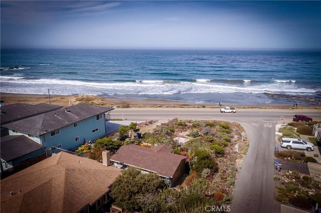 bird's eye view with a water view and a view of the beach