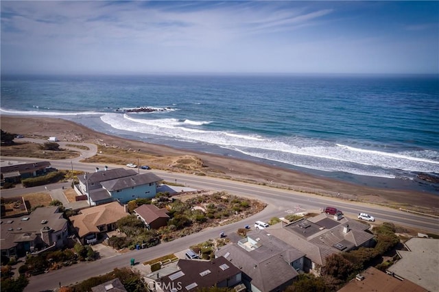 bird's eye view with a view of the beach and a water view