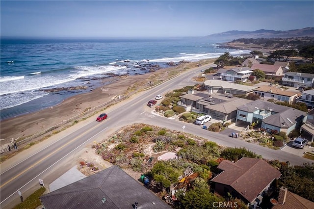 birds eye view of property featuring a water view and a view of the beach