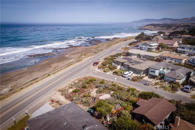 aerial view featuring a water view and a beach view