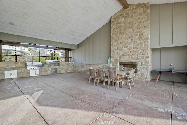 view of patio / terrace featuring a grill, sink, and an outdoor kitchen