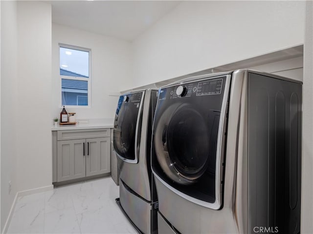 clothes washing area featuring washer and dryer