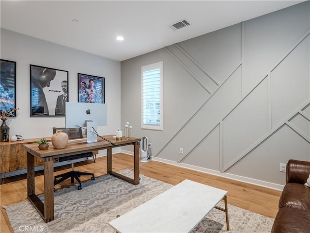 office area with light hardwood / wood-style floors