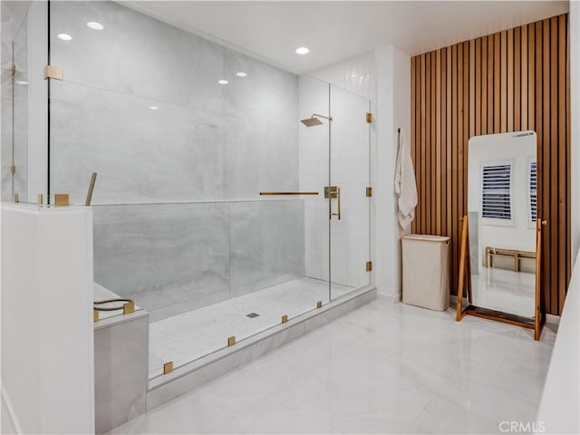 bathroom featuring a shower with shower door