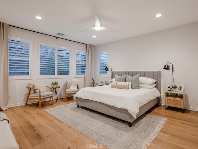 bedroom with ceiling fan and hardwood / wood-style floors