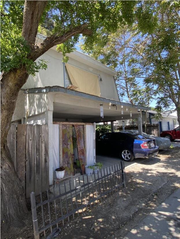 view of property exterior featuring a carport