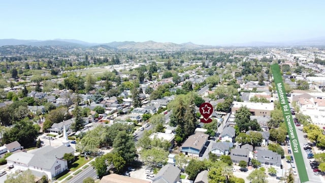 birds eye view of property featuring a mountain view