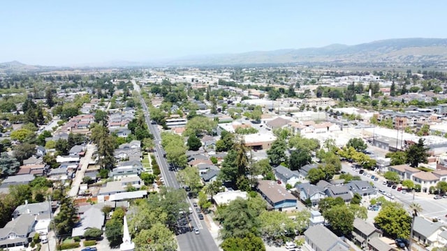 birds eye view of property with a mountain view