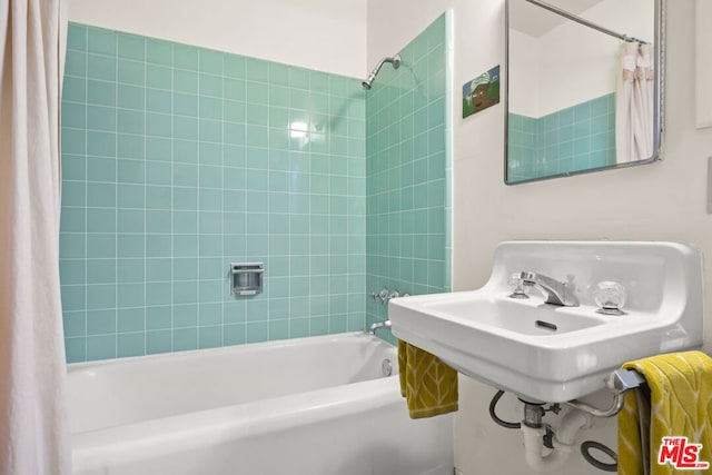 bathroom with shower / bath combination with curtain