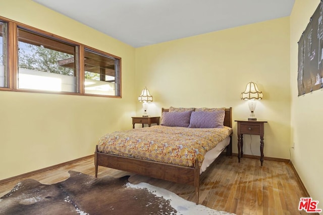 bedroom featuring wood-type flooring