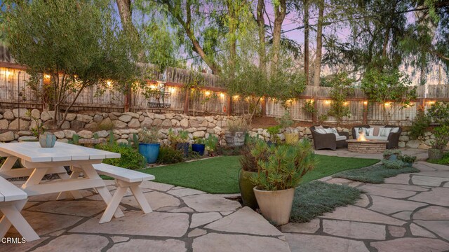 patio terrace at dusk with outdoor lounge area