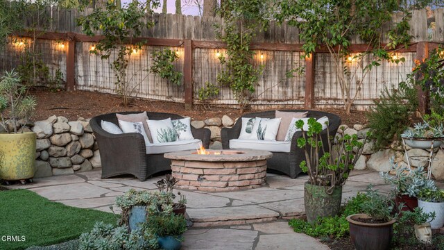 view of patio / terrace with a fire pit