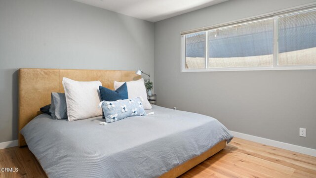 bedroom featuring hardwood / wood-style flooring