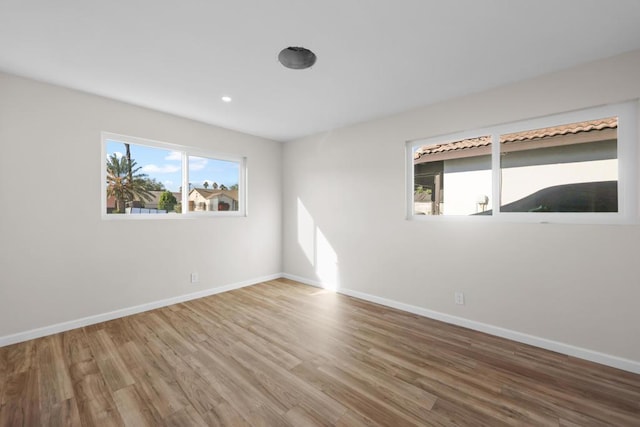 unfurnished room featuring wood-type flooring