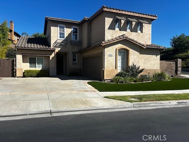 mediterranean / spanish-style home featuring a garage