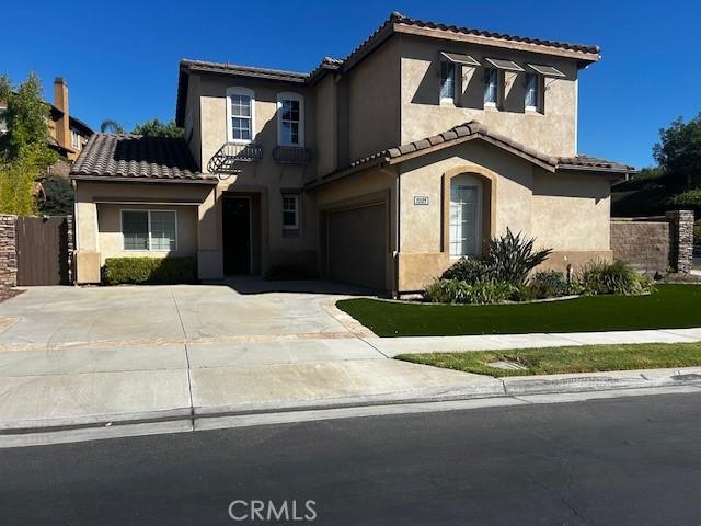 mediterranean / spanish-style house featuring a garage