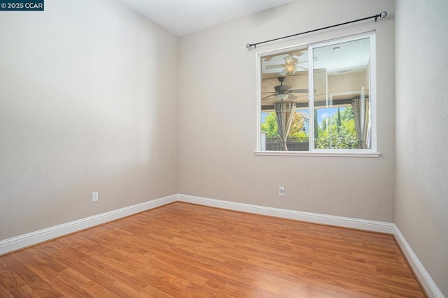 unfurnished room featuring ceiling fan and light hardwood / wood-style floors