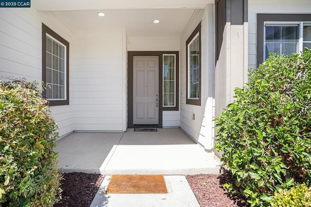 doorway to property with covered porch