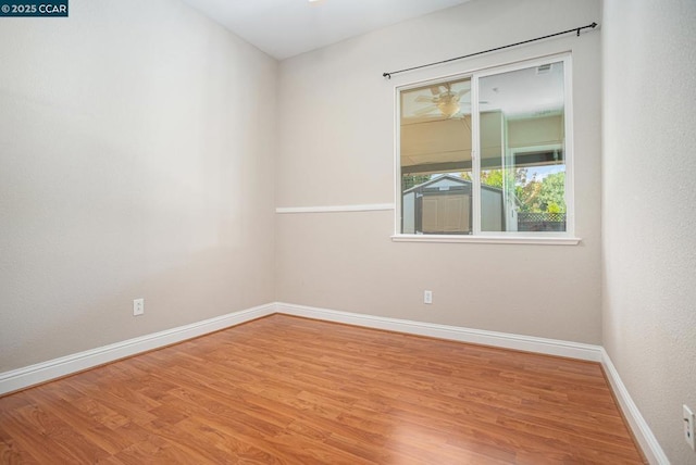 unfurnished room featuring hardwood / wood-style flooring