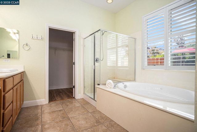 bathroom with vanity, separate shower and tub, and tile patterned flooring