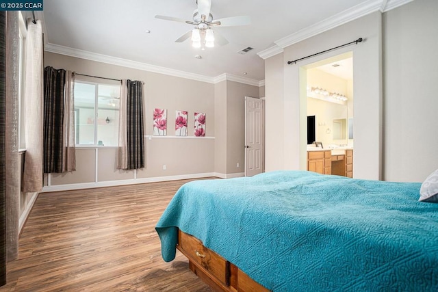 bedroom with ceiling fan, crown molding, ensuite bath, and hardwood / wood-style floors