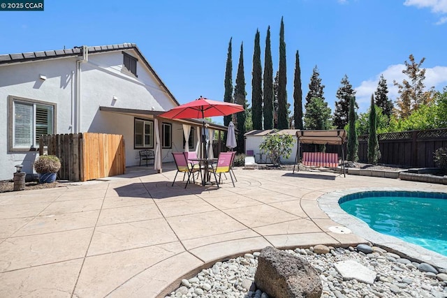 view of pool featuring a patio area