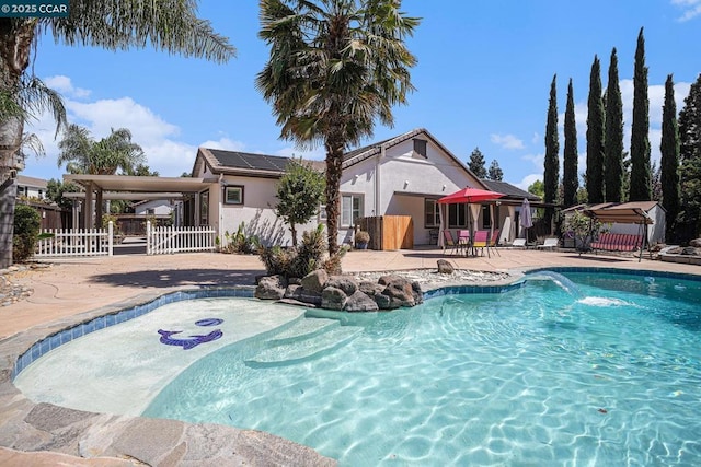 view of swimming pool featuring a patio area