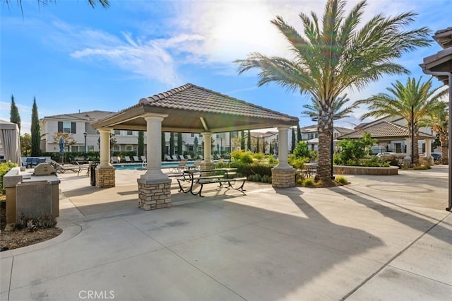 view of community featuring a gazebo, a patio, and a swimming pool