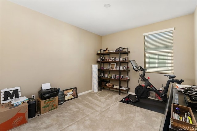 exercise room with light carpet