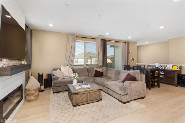 living room with light hardwood / wood-style floors