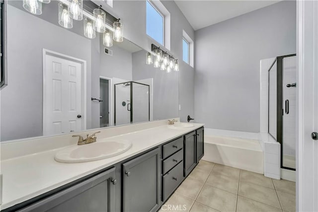 bathroom with plus walk in shower, tile patterned flooring, and vanity