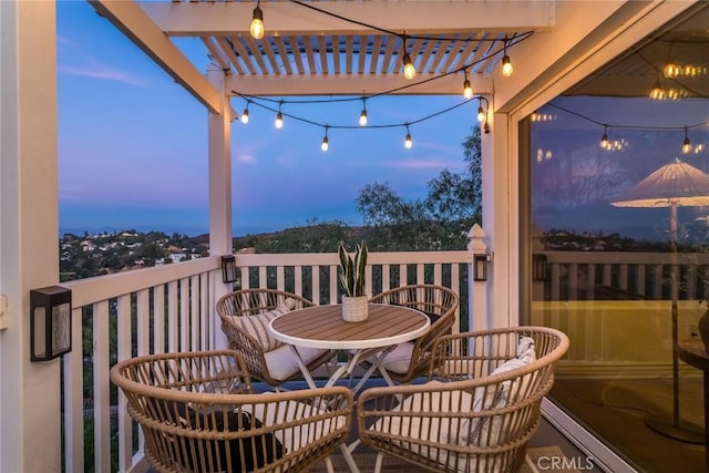 view of balcony at dusk