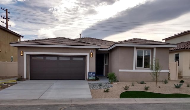 prairie-style home featuring a garage