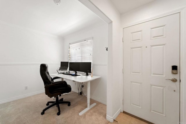 carpeted office space featuring ornamental molding