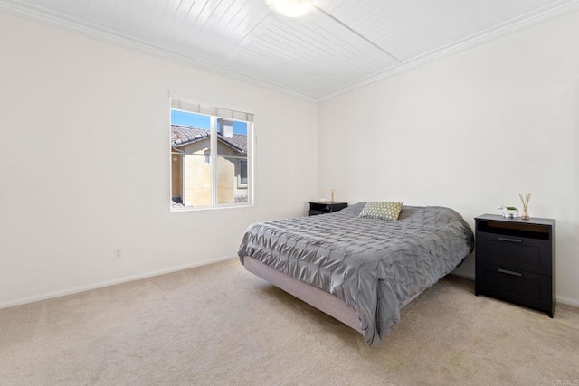 bedroom featuring light colored carpet and crown molding