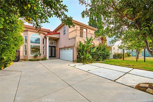 view of front of house featuring a front lawn, a garage, and a balcony