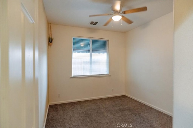 carpeted empty room featuring ceiling fan