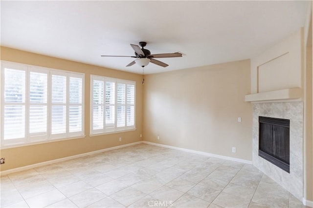 unfurnished living room with a fireplace and ceiling fan