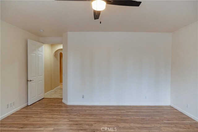 spare room with ceiling fan and light hardwood / wood-style floors