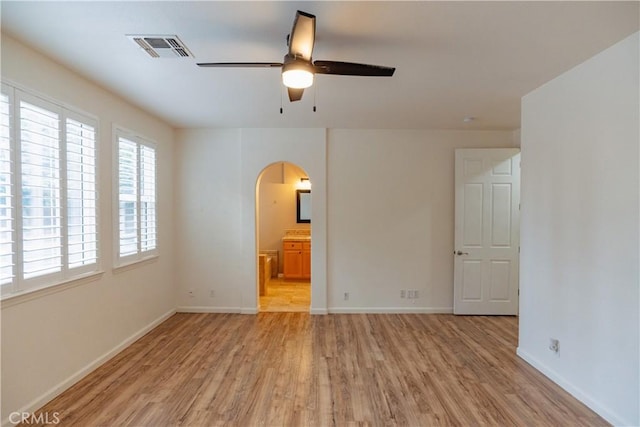 unfurnished room featuring light hardwood / wood-style floors and ceiling fan