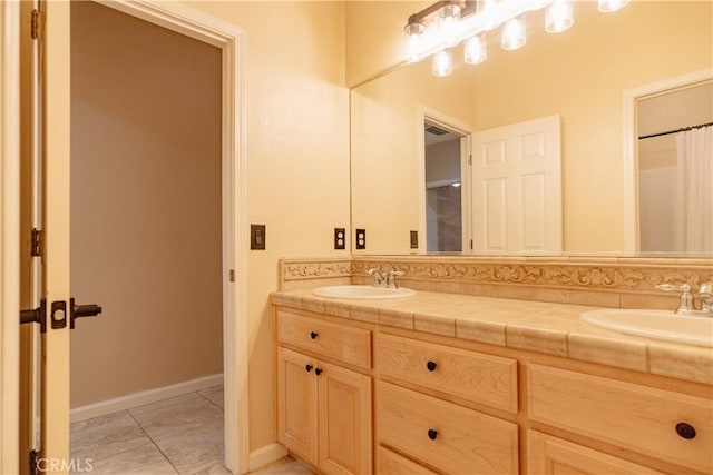 bathroom with vanity and tile patterned flooring