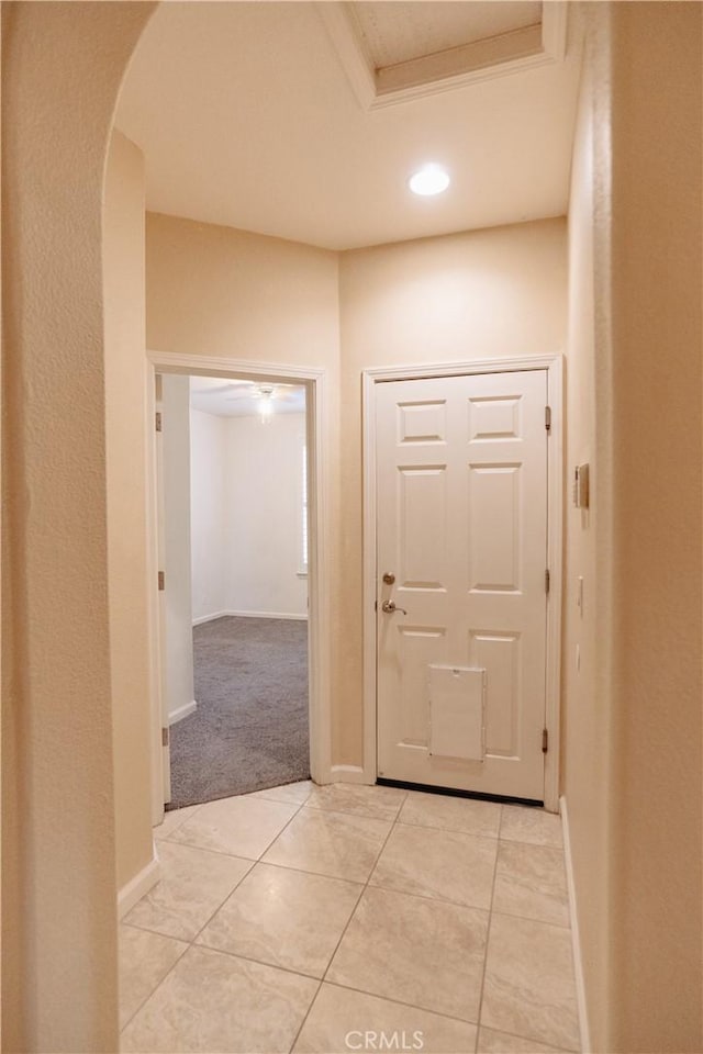 hallway featuring light tile patterned floors