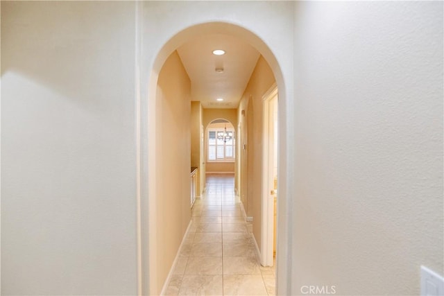 hall featuring light tile patterned floors