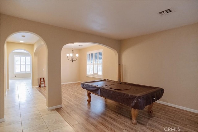 rec room with light hardwood / wood-style flooring and billiards