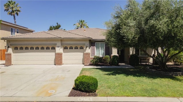 view of front of home featuring a garage and a front lawn