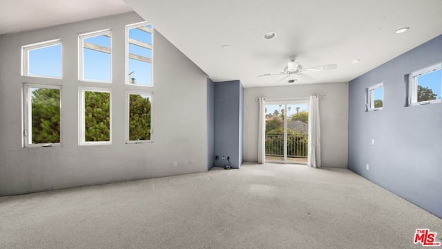 unfurnished room featuring ceiling fan and light colored carpet